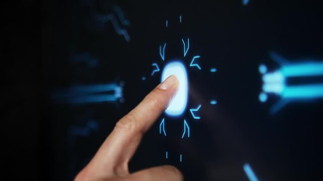 Digitalization concept: The human finger Turns on the Touch screen button and activates Futuristic artificial intelligence. Computer Technologies Vertically. Soft Focus.