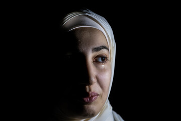 portrait of middle eastern girl in a dark room