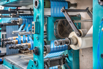 Production of duct tape.Packing tape manufacturing. Strapping Machine for Industrail Packaging Line, Modern machine for packaging line in factory, Industrial and technology concept.