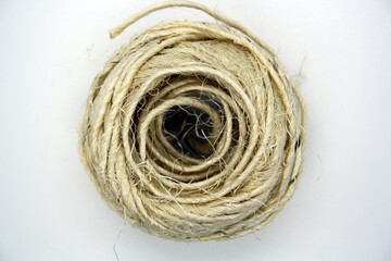 Twine for tying plants on a white background.