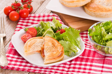 Puff pastry filled with tomato and mozzarella cheese.