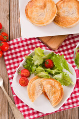 Puff pastry filled with tomato and mozzarella cheese.