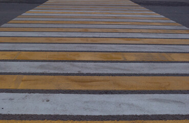 texture of a pedestrian crossing across the road. background for asphalt road crosswalk website template