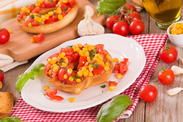 Friselle with tomatoes and mais. 