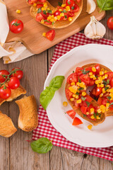 Friselle with tomatoes and mais. 