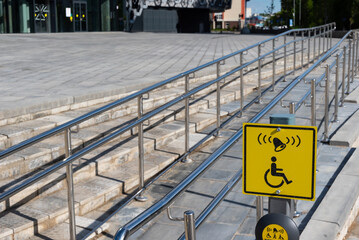 wheelchair ramp to the square next to the shopping center in the city