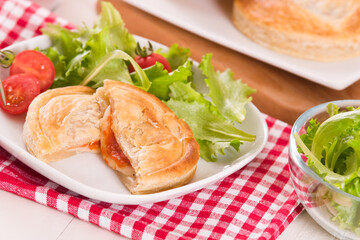 Puff pastry filled with tomato and mozzarella cheese.