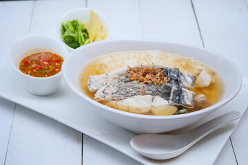 Boiled rice soup with sea bass