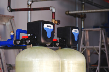 
Install a water softener tank system inside the building.