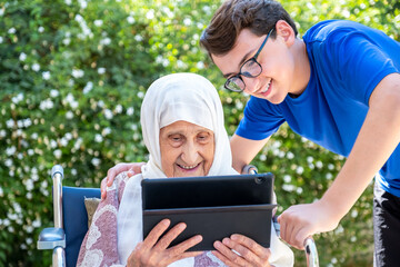 Trying technology with her grandchild