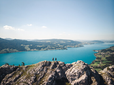 Two people standing on top of the Schoberstein summit at the Attersee in Upper Austria, Austria