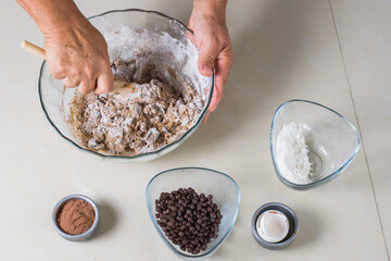 Ingredients for making chocolate cookies, flour sugar, eggs and cocoa are placed on a table