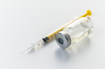 syringe and medicine bottle