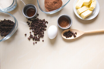 Ingredients for preparing chocolate chip cookies on a table