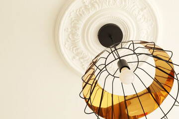 Fototapeta na wymiar black and golden modern ceiling lamp