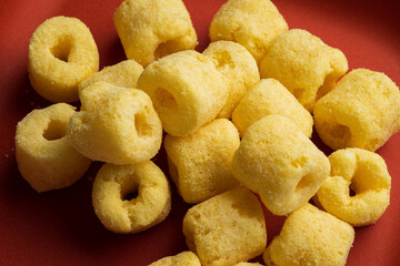 Crispy Corn rings salty snacks. Fast food or junk food snacks unhealthy concept.