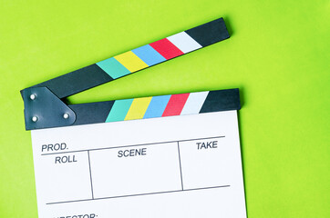 Clapperboard on green background