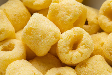 Crispy Corn rings salty snacks. Fast food or junk food snacks unhealthy concept.