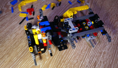 Obraz premium Assembling a toy constructor by a child. 