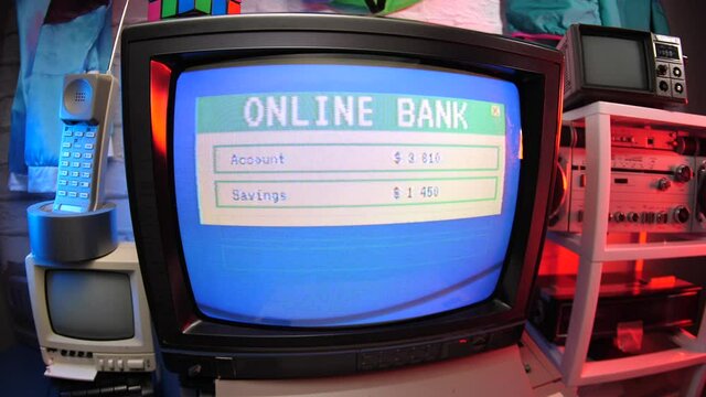 Online banking in the 80s 90s on a vintage CRT computer screen showing the statement.
