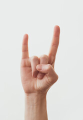female hand show Rock and roll sign and love and heart.