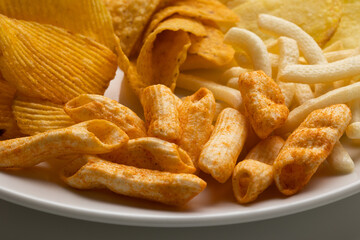 Many Crispy Snacks food potato chip salty. Fast food or junk food snacks unhealthy concept.