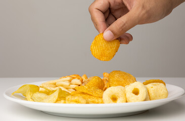 Many Crispy Snacks food potato chip salty. Fast food or junk food snacks unhealthy concept.