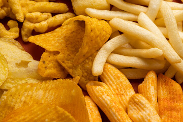 Many Crispy Snacks food potato chip salty. Fast food or junk food snacks unhealthy concept.