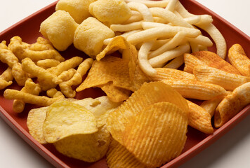 Many Crispy Snacks food potato chip salty. Fast food or junk food snacks unhealthy concept.