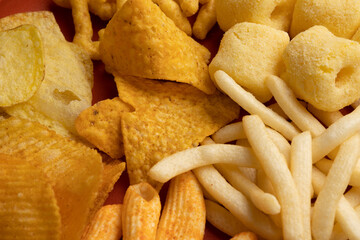 Many Crispy Snacks food potato chip salty. Fast food or junk food snacks unhealthy concept.