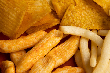 Many Crispy Snacks food potato chip salty. Fast food or junk food snacks unhealthy concept.