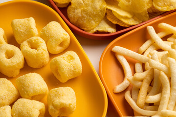 Many Crispy Snacks food potato chip salty. Fast food or junk food snacks unhealthy concept.