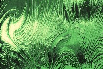 shades of green patterned glass designed as simple wave form as modern abstract futuristic art shapes and designs