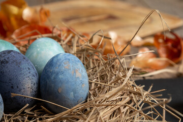 Easter eggs on rustic wooden background. Happy Easter greeting card template