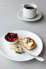 Breakfast of cheesecakes on a plate with sour cream.