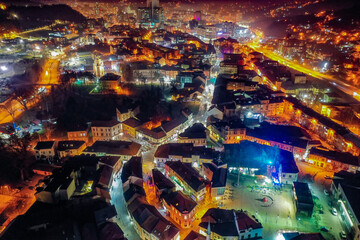 Aerial view of downtown Tuzla at night, Bosnia. City photographed by drone, traffic and objects , landscape