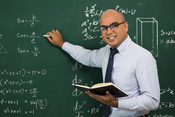 Young asian teacher man teaching video conference with student. Male Indian teacher training the mathematics in classroom from online course.