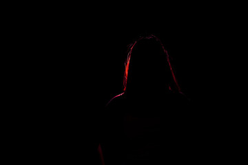 Colorful portrait of woman silhouette isolated on black background. Horizontal shot, copy space for text message.