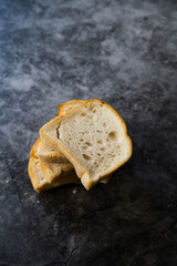 Gluten Free Bread Slices Ready to Eat on Grey Surface.