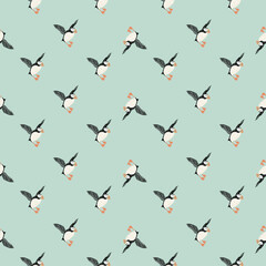 Abstract zoo wild seamless arctic pattern with puffin bird print. Blue pastel background. Creative design.