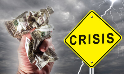 Financial crisis. Road sign with crisis logo on rainy sky background. Bad weather as symbol of impending problems. Man hand crumples money. Concept - imminent economic crisis. Recession approaching