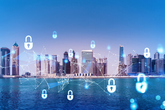 Skyscrapers of Dubai business downtown. International hub of trading and financial services. Lock icon hologram, concept of datum security. Double exposure. Dubai Canal waterfront.