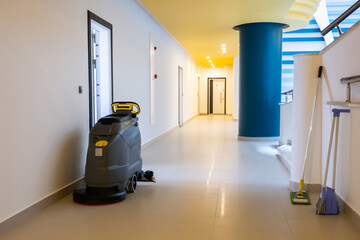 Sweeping machine for a building or compound entrance