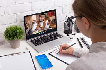 Young woman office worker attending online class