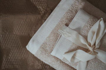Fototapeta na wymiar Towels set in boho interior in brown tones