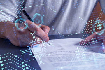 A client is signing a contract to create a new software to present it in start up conference and gain investments to create a product. Technological graph over the desk.
