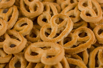 small cookie pretzels in sugar a lot on the background