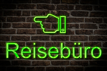 Fototapeta premium Leuchtreklame Reisebüro