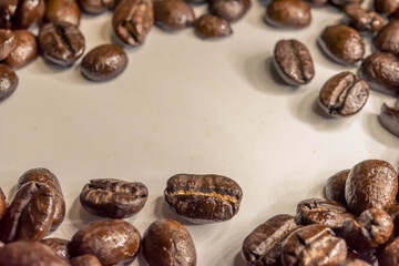 Coffee beans isolated on white background. Close up of a bean of coffee to represent the good smell.