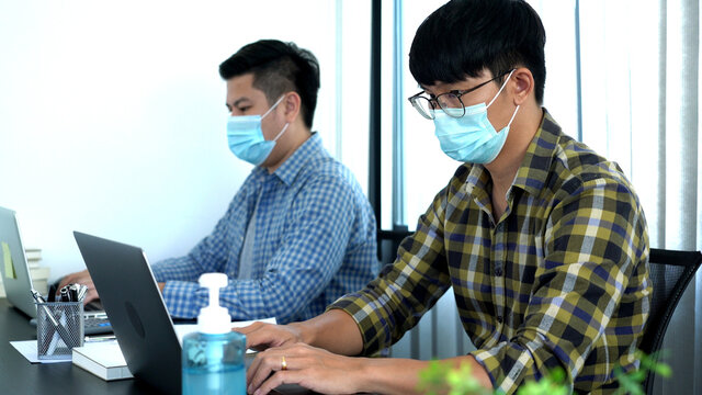 Coronavirus Office Workers With Mask For Corona Virus Pandemic In The World Working In Office After Lockdown But Business Must Be Continuous.